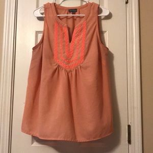 Peach and coral colored blouse